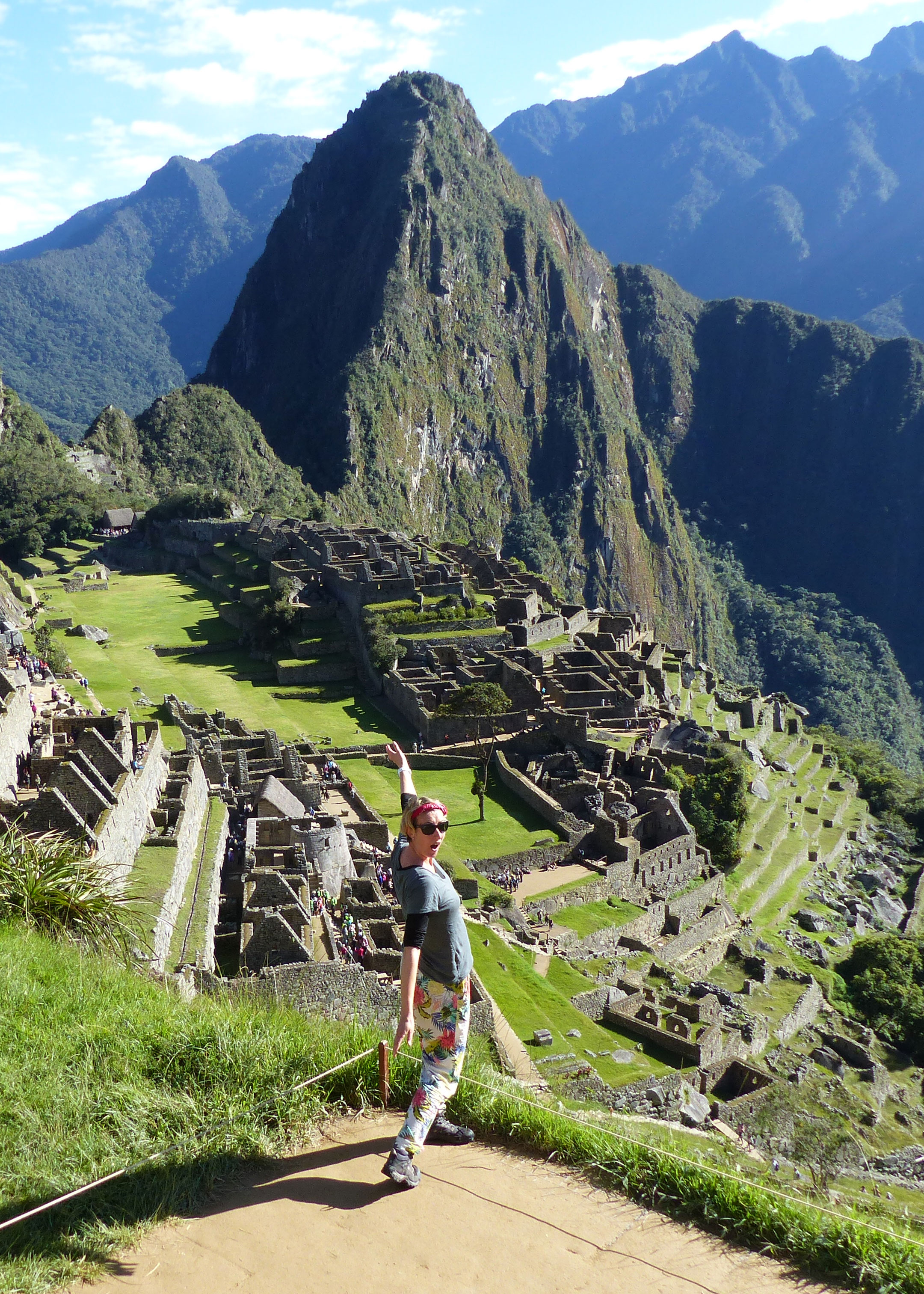 Woman standing in front of Machu Picchu in Peru